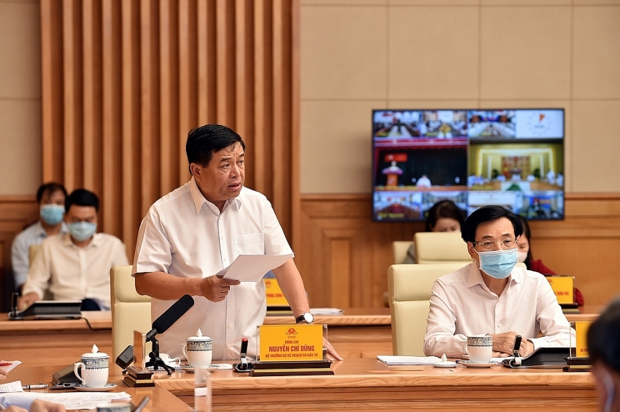 Bộ trưởng Bộ KH&ĐT Nguyễn Chí Dũng báo cáo tại Hội nghị (Ảnh: VGP/Nhật Bắc)
