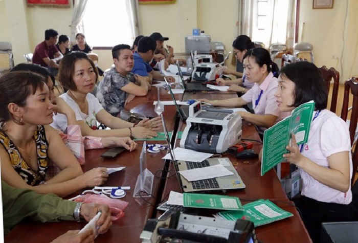 Hà Nội giao 650 tỷ đồng vốn ủy thác giúp người dân vượt khó - 1